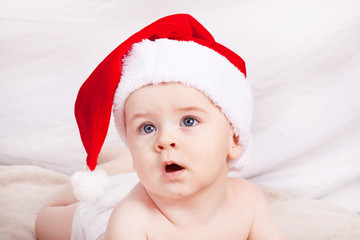 Beautiful little baby celebrates Christmas.