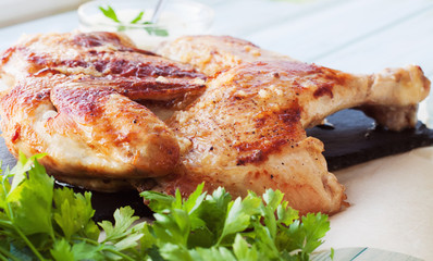 Rosted chicken on a slate plate