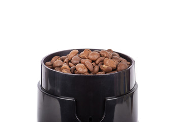 Coffee mill and pile of coffee beans