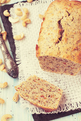 Homemade banana and nuts bread on a wooden table