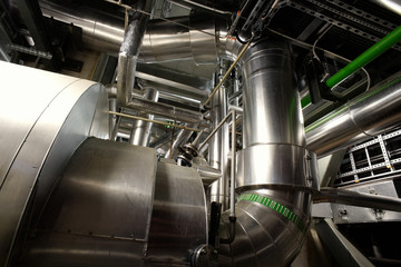 different size and shaped pipes and valves at a power plant