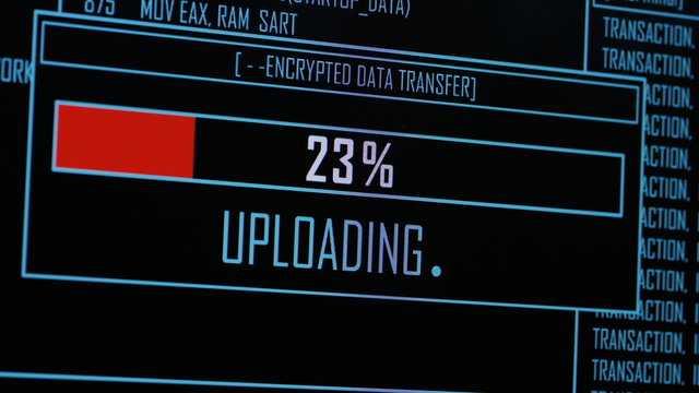 4K Screen of computer code loading as an upload bar transfers data