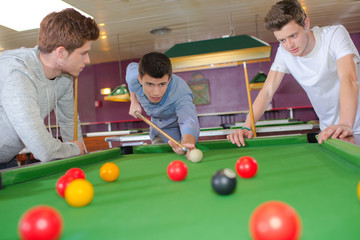 Young lads playing snooker