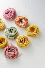 colorful pasta on wooden background