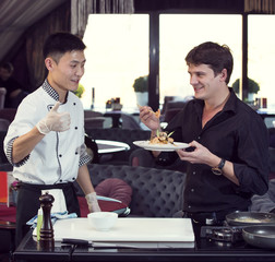 Japanese chef preparing a meal with the customer