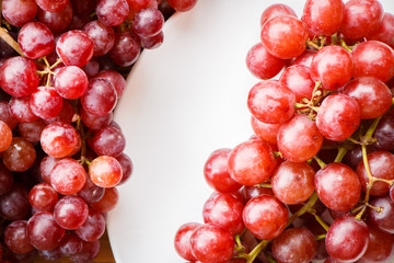 Red grape on wooden table, Healthy concept.