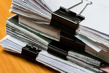 Black clips and stack of sheets