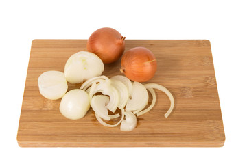 Fresh sliced onions on a board on a white background