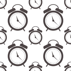Seamless vector pattern. Symmetrical background with closeup black alarm clocks on the white background.