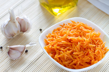 Korean carrots with ingredients for cooking : carrots grated straw, oil, pepper and garlic. Asian cuisine. 