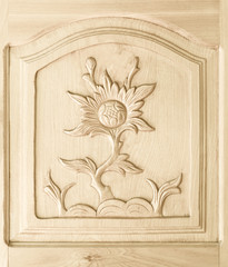  carved of flower pattern on wooden door background
