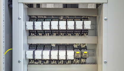 Electrical control panel with relays and wires closeup