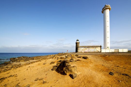 atlantic ocean lanzarote lighthouse and rock in the blue sky