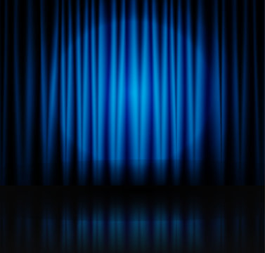 Spotlight on blue stage curtain