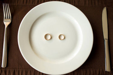 Wedding rings on a white plate