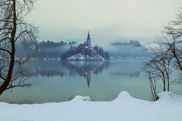 Foggy evening on Bled lake at winter