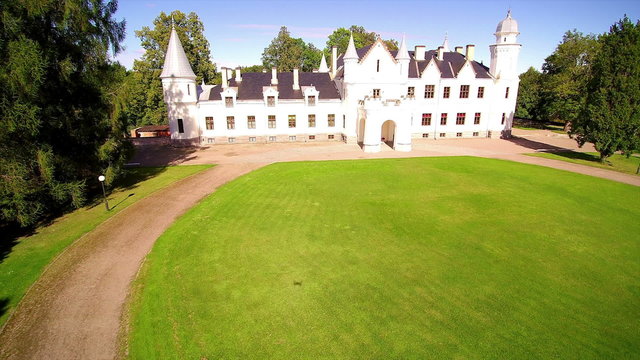 The big white house manor in Alatskivi Estonia. Alatskivi Manor combines three completely different cultures: the Scottish culture represented in the architecture of the manor house