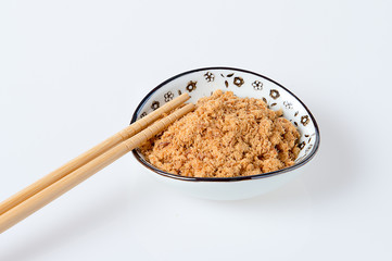 pork floss in the plate with chopsticks on white background