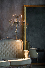 Unusual, vintage interior with a sofa and a mirror