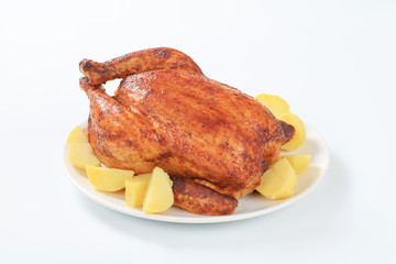 Marinated roasted chicken with potatoes