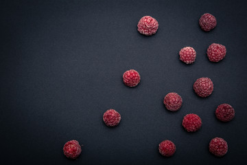 Fototapeta premium Frozen Raspberry On Black Background