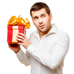 Young man carries heart shaped box