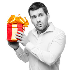 Young man carries heart shaped box