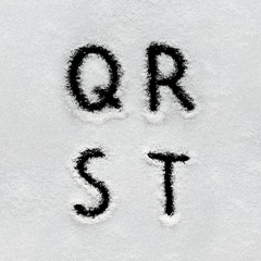 Winter alphabet, symbols and numbers hand written on snow.
