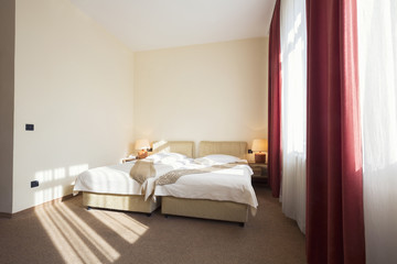 Fototapeta na wymiar Hotel room interior with two beds