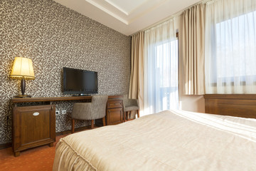 Interior of a hotel bedroom in the morning, sunlight
