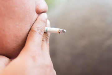 man smoking cigarette