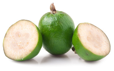 One whole and a half feijoa isolated on white background