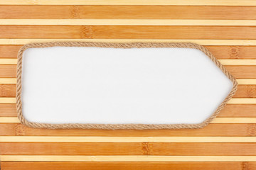 Pointer made of rope with a white background on the bamboo mat