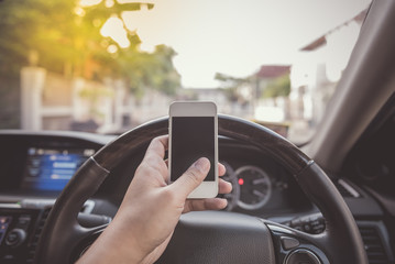 driver using white touch screen smartphone