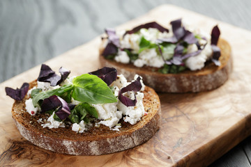 rye sandwich or bruschetta with ricotta, herbs and basil