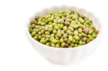 Mung beans in white cup.