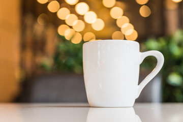 white coffee cup in coffee shop