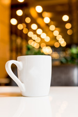 white coffee cup in coffee shop