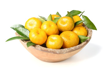 fresh orange fruit in the wooden bowl