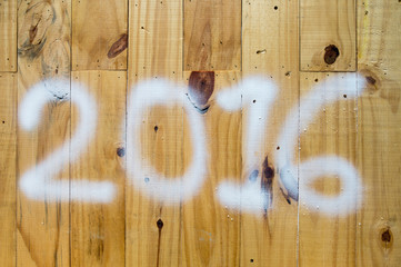 Happy New Year 2016 as a wooden background.
