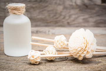 Decorative white flowers with essential massage oil