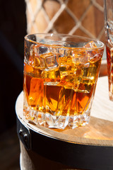 Glass of whiskey with ice