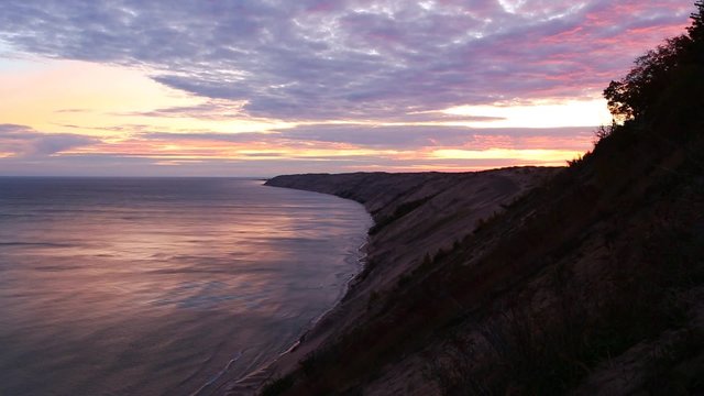 Log Slide Overlook at Sunrise. Colorful skies over Grand Sable Dunes as the sun rises over Lake Superior in the upper peninsula of Michigan. Near Grand Marais