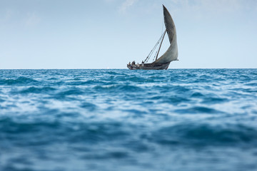 Fishermen returning from work at midday on Zanzibar Island off t