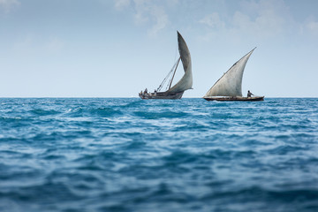 Dhow wooden fisher boat on the Indian Ocean near Zanzibar, Tanza - obrazy, fototapety, plakaty