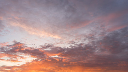 Naklejka na ściany i meble Bright sunset with dramatic cloudscape 
