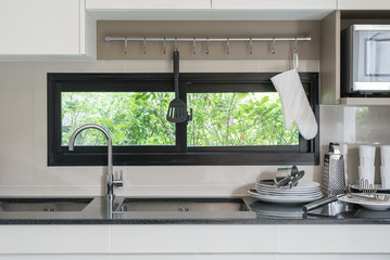 modern pantry with sink and faucet on counter at