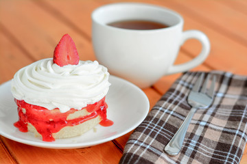 Tea break with strawberry cake.