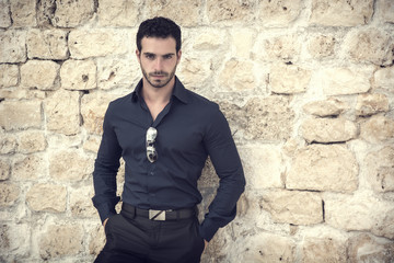 Gorgeous Young Elegant Man Against Old Wall