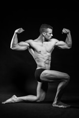 Fototapeta na wymiar Muscled man with an athletic pose like a greek god